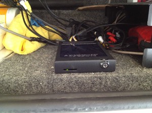 in vehicle video surveillance recorder mounted in accessory shelf